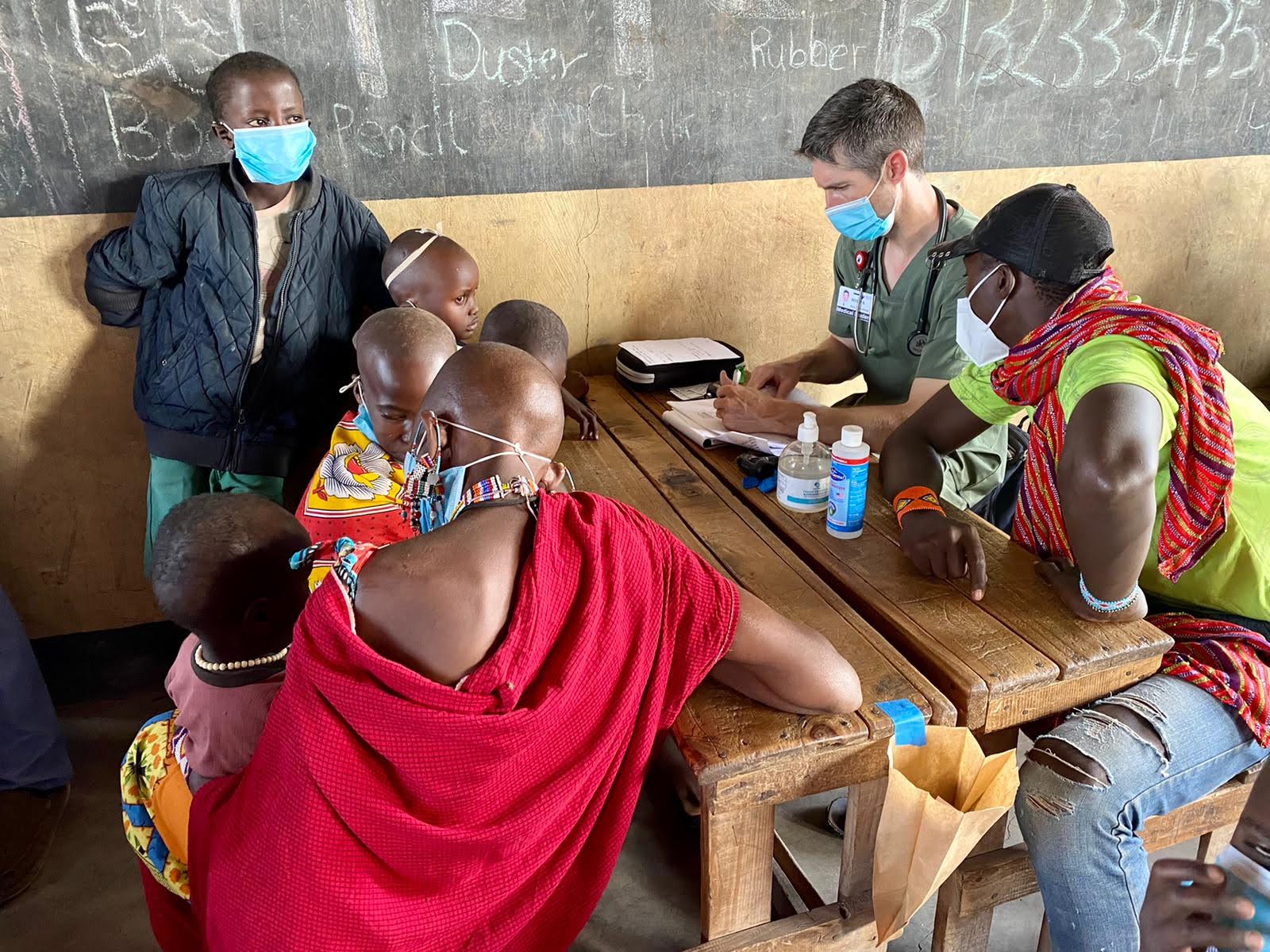 Volunteers and local clinicians treating patients side by side